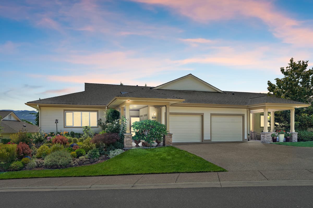Exterior photo of a Rogue Valley Manor cottage at dusk.