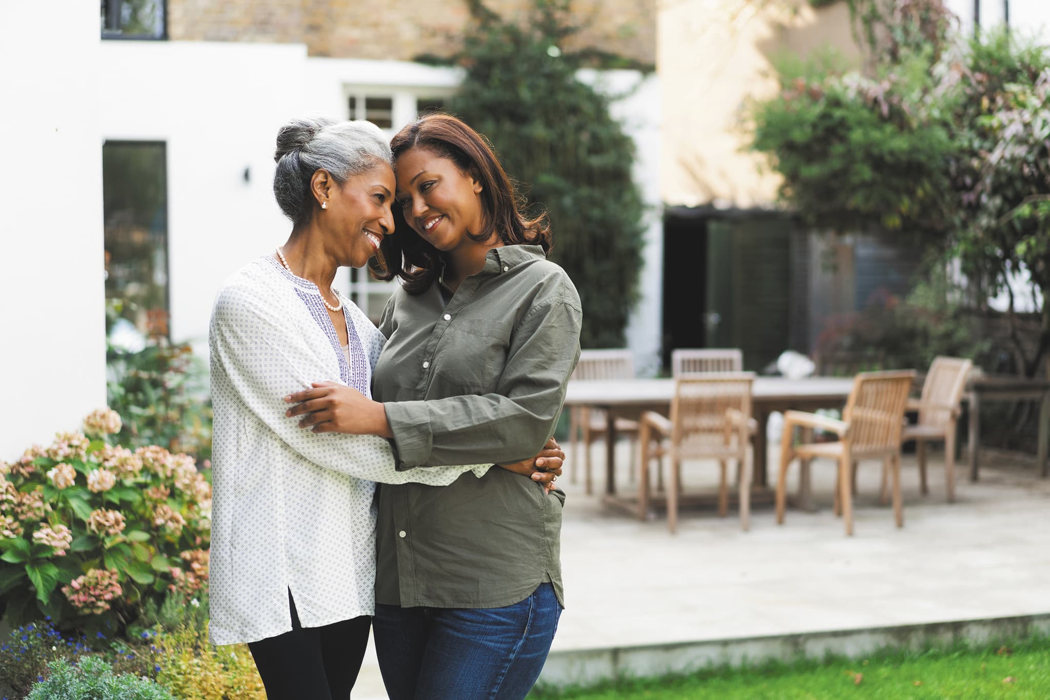 Mother and daughter embracing.